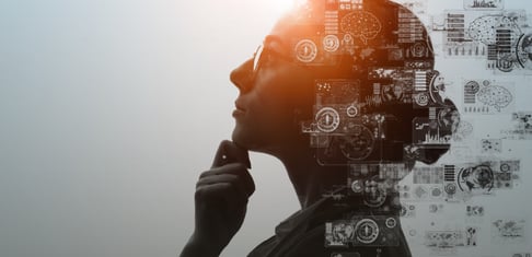 Woman reflecting on business analytics and AI use