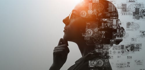 Woman reflecting on business analytics and AI use