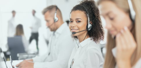 call center agent on the phone smiling
