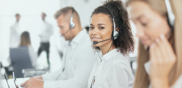 call center agent on the phone smiling