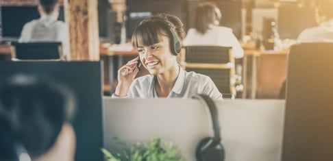 Call center agent on the phone smiling