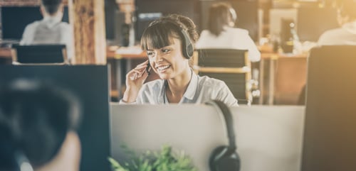 Call center agent on the phone smiling